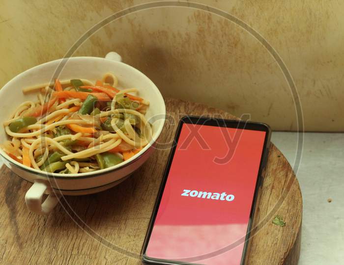 Zomato Food delivery application icon on smartphone