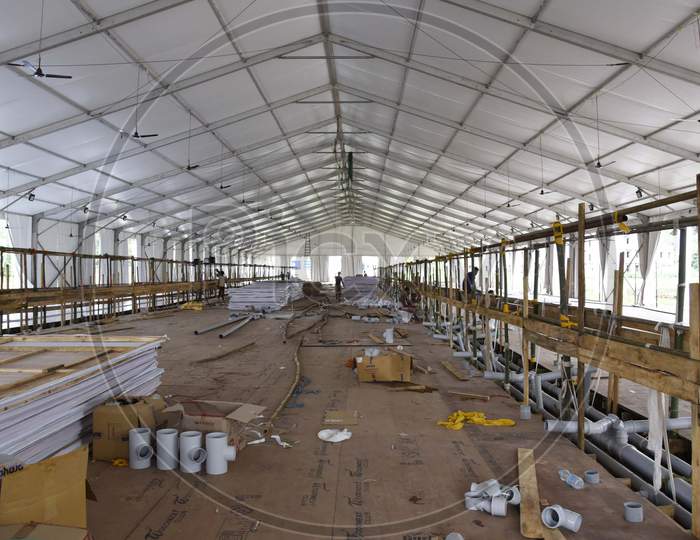 Workers build a quarantine center for treating COVID-19 patients