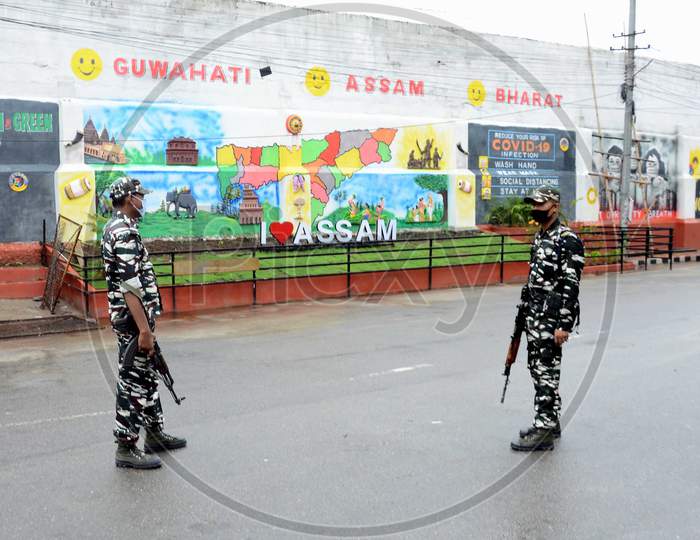 Security personnel patrol at Fancy Bazar