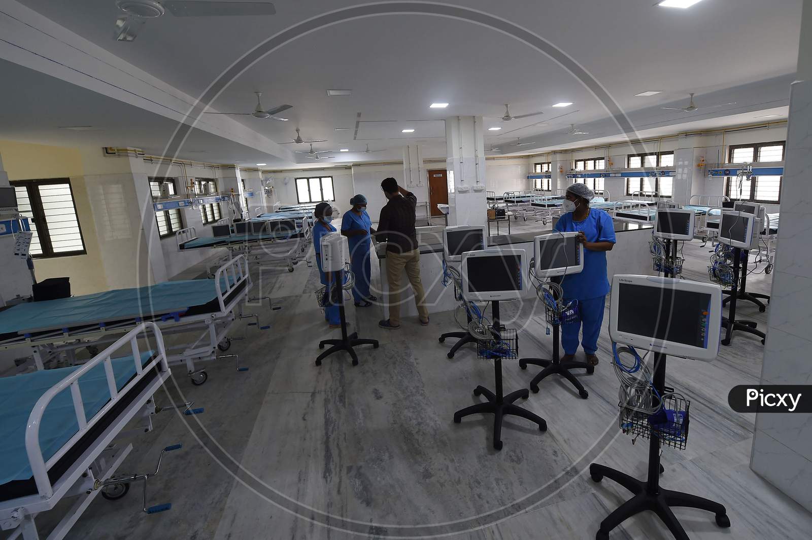 Health care workers check medical equipment in a building which belonged to the National Institute of Ageing that has been converted into a dedicated Covid-19 Care Centre in Chennai, Tamil Nadu on July 07, 2020