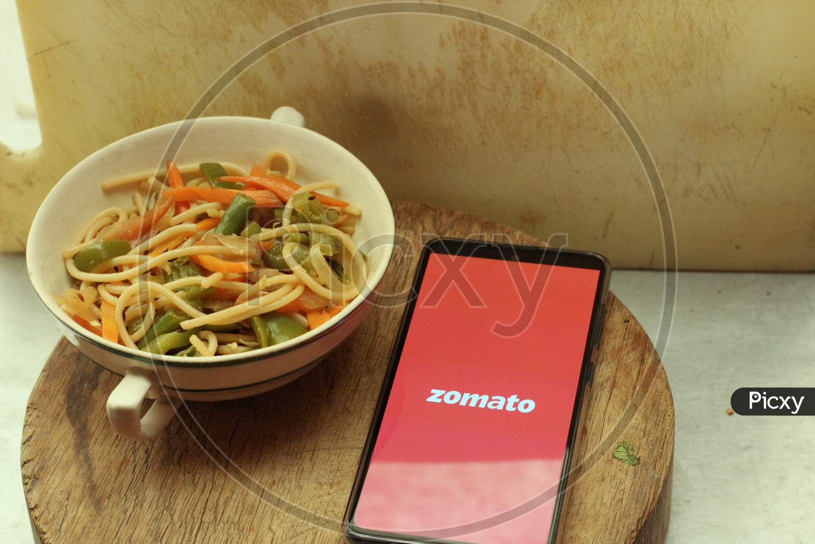 Zomato Food delivery application icon on smartphone