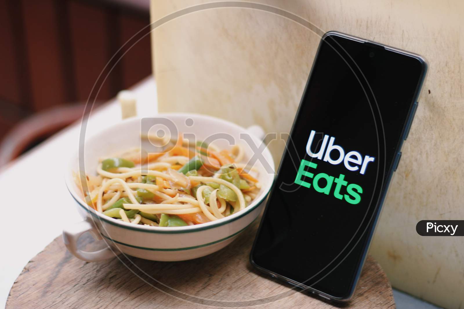 Uber eats Food delivery application icon on smartphone