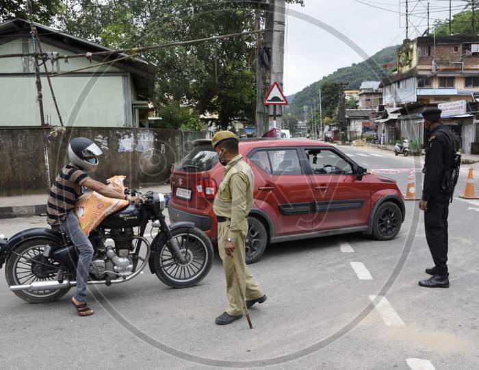 Security personnel stop commuters