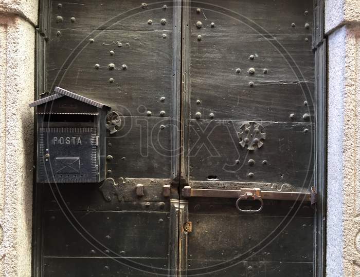 Old Metallic Post Box On Wood Door
