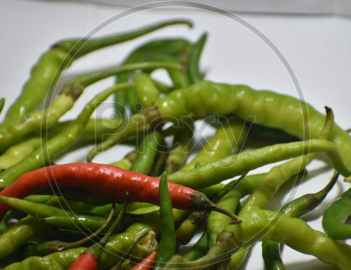 Green and red chilli peppers in Indian market