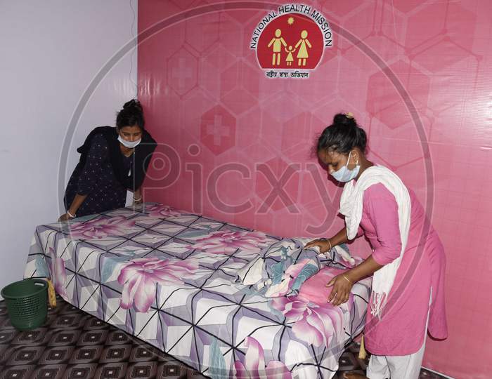 Worker prepares a bed at a quarantine centre