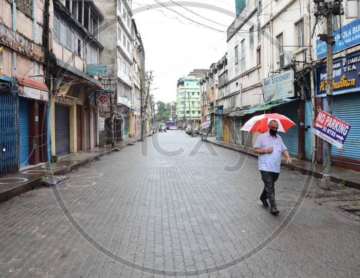 A man walk in a deserted Fancy Bazar