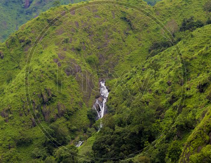 WATERFALL IN GREEN MOUNTAINS PARUNTHUMPARA IDUKKI