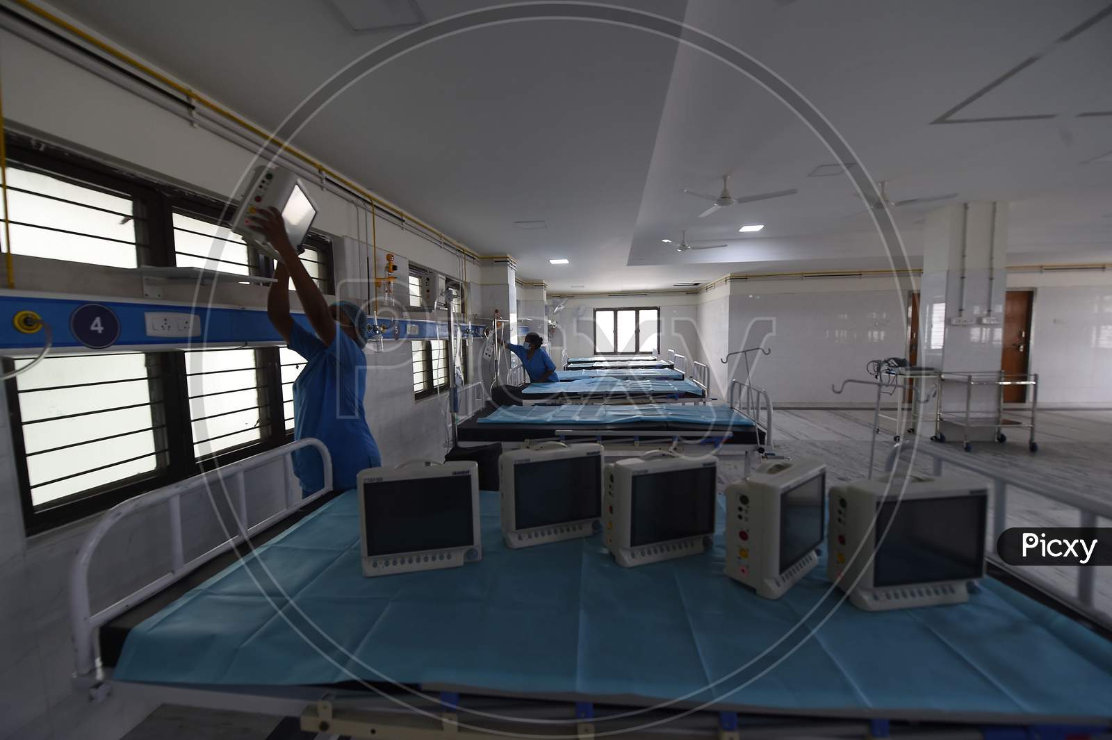 Health care workers arrange medical equipment in a building which belonged to the National Institute of Ageing that has been converted into a dedicated Covid-19 Care Centre in Chennai, Tamil Nadu on July 07, 2020