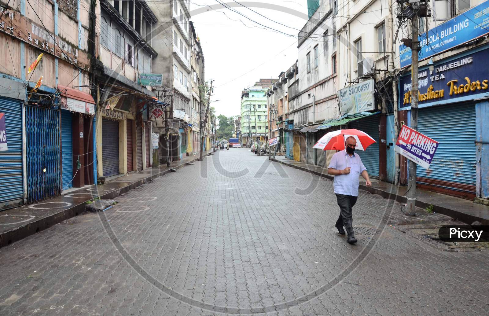 A man walk in a deserted Fancy Bazar