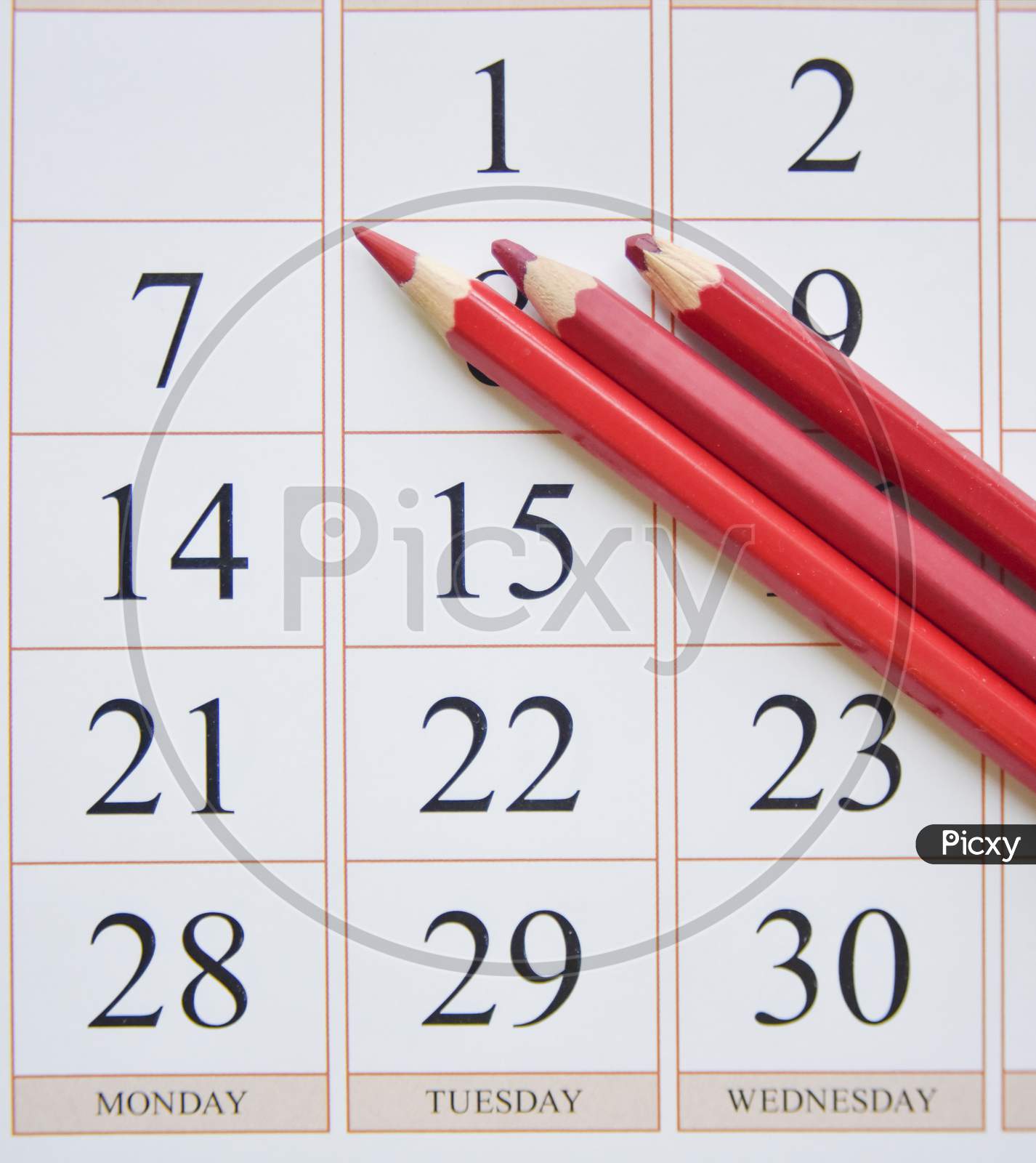 Calendar And Three Red Pencils Near The Last Date