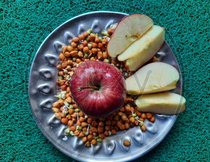 Indian healthy breakfast Red Apple, germinated grams, green moong