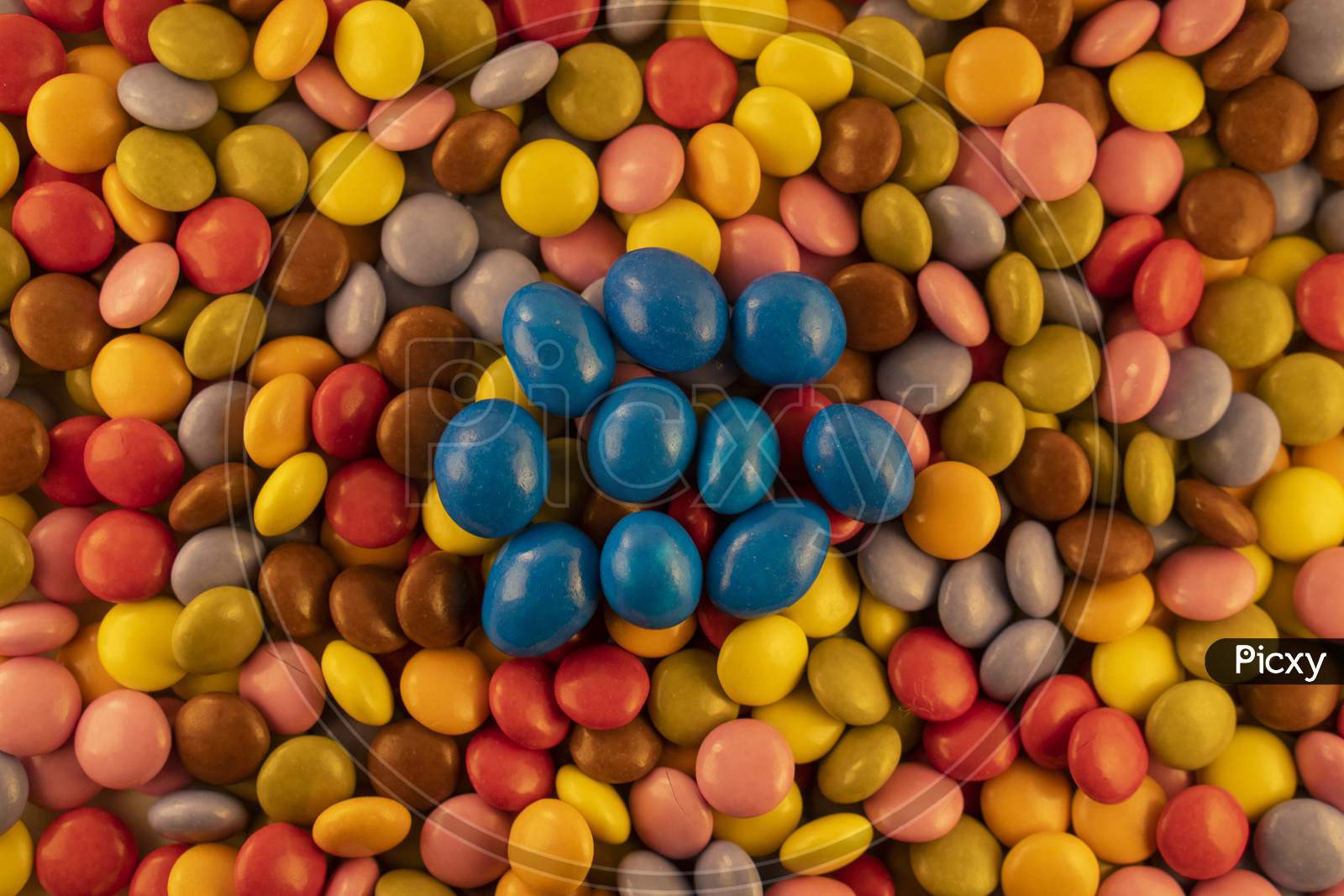 Background of multicolored chocolate balls with a depth of field view