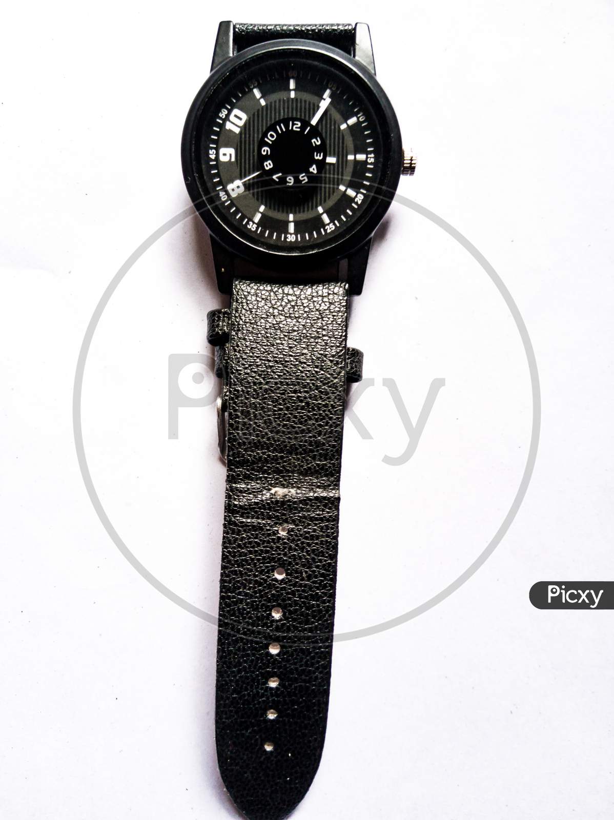 Black wrist watch on white background