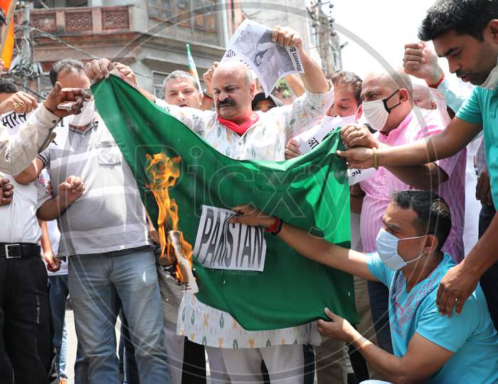 Bharatiya Janata Yuva Morcha (BJYM) workers burn the Pakistan's flag in Jammu, to protest the killings of Sheikh Wasim Bari and his family members by suspected militants in Bandipora