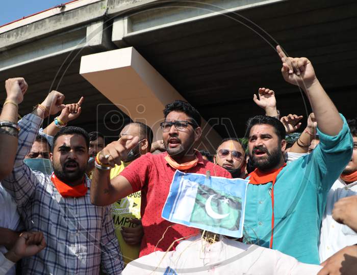 Bharatiya Janata Yuva Morcha (BJYM) workers burn the effigy of Pakistan's Prime Minister Imran Khan in Jammu, to protest the killings of Sheikh Wasim Bari and his family members by suspected militants in Bandipora