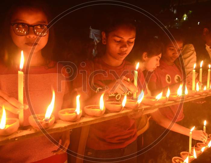 lighting earthen lamp in memory of martyrs