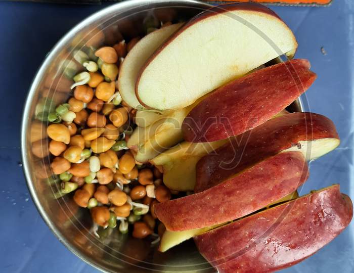 Indian healthy breakfast Red Apple, germinated grams, green moong