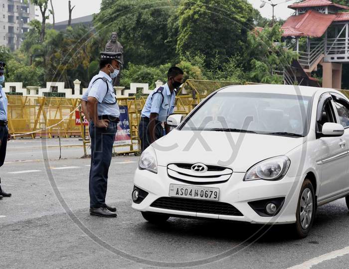 Traffic Police personnel stop a commuter