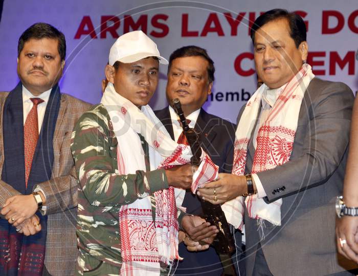 Members of Extremist Outfits hand over Arms to Assam Chief Minister Sarbananda Sonowal