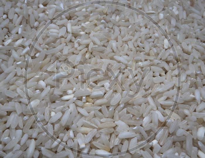 Closeup View Of Uncooked White Rice Background