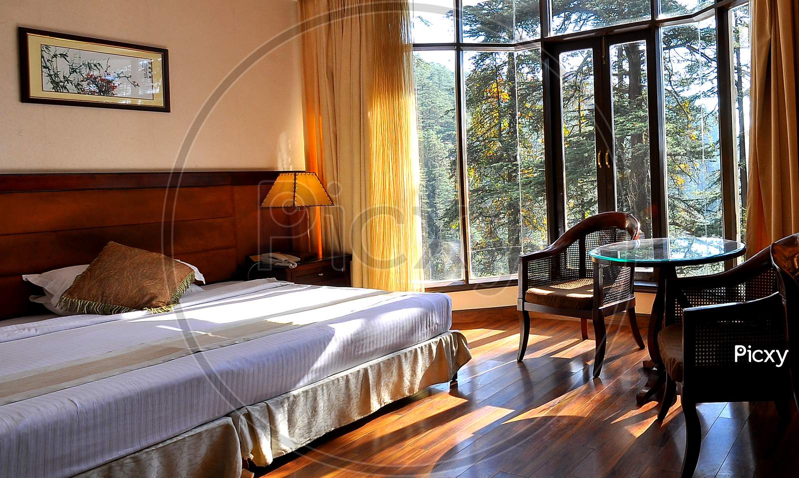 Beautiful Interior of a bedroom with landscape view of sunrise natural light Kerala