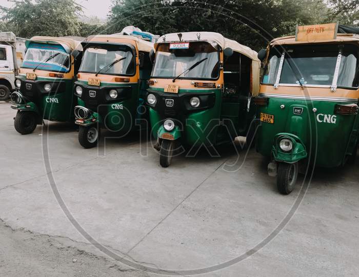 Delhi, India, 15 June 2020 - Group Of Indian Auto Rikshaw On The Street (Tuk-Tuk) Used By Tourists And Local As Means Of Transportation