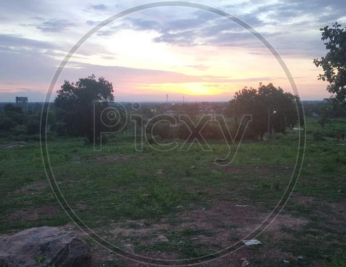 Sunrise View From Mountain In Green Countryside Area
