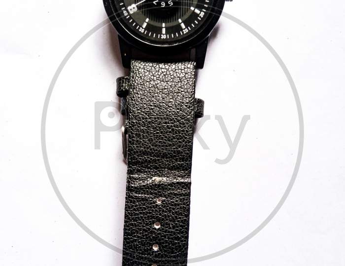 Black wrist watch on white background
