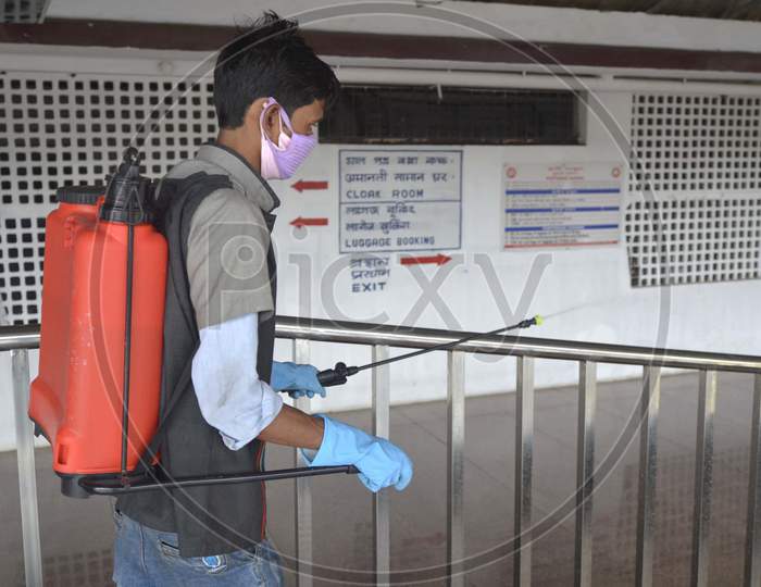 worker sprays disinfectants