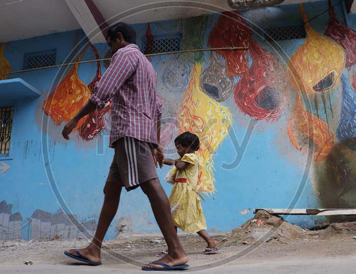Girl Child walking with Father