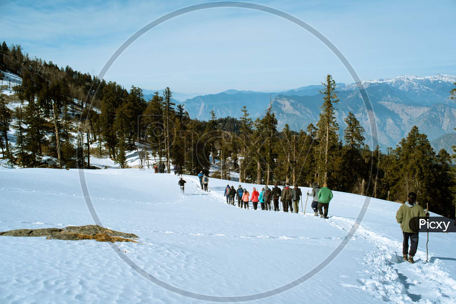 Winter trekking in snow-capped mountains of Himalaya