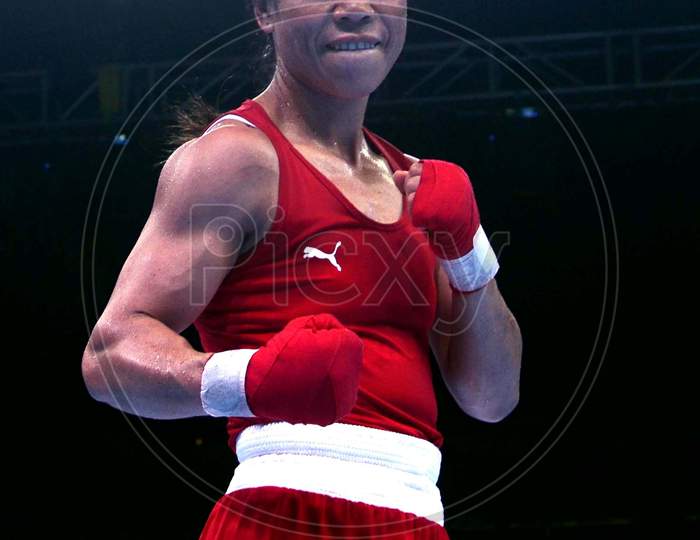India's boxer   Mc Mary Kom (Red)  poses after winning