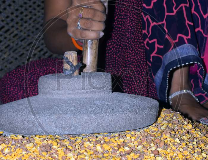 A Village Woman'S Hand, Grinds Gram In An Old Hand Operated Flour Mill.