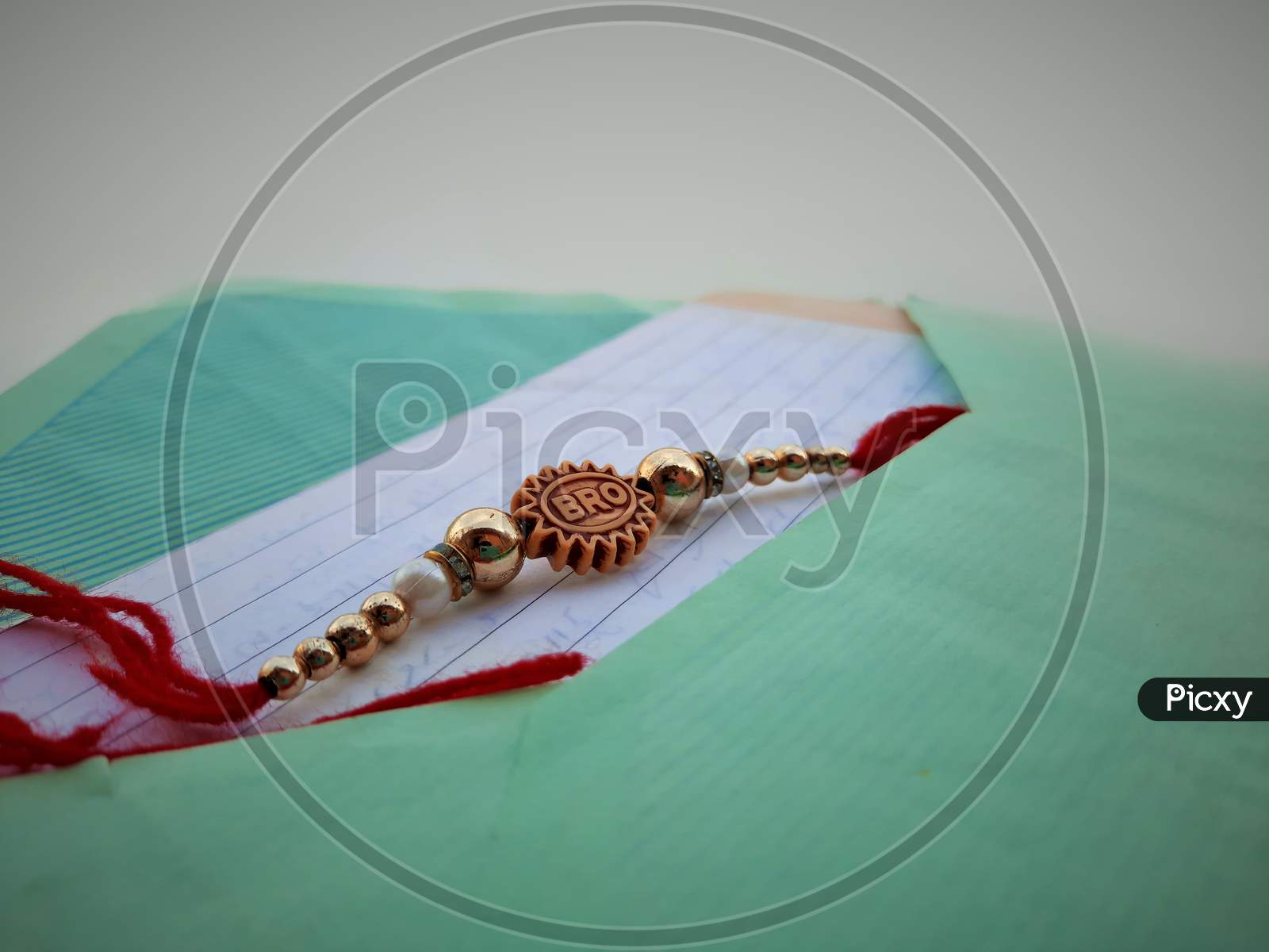 Closeup Of Rakhee Or Holy Thread With Message In Envelope On Raksha Bandhan