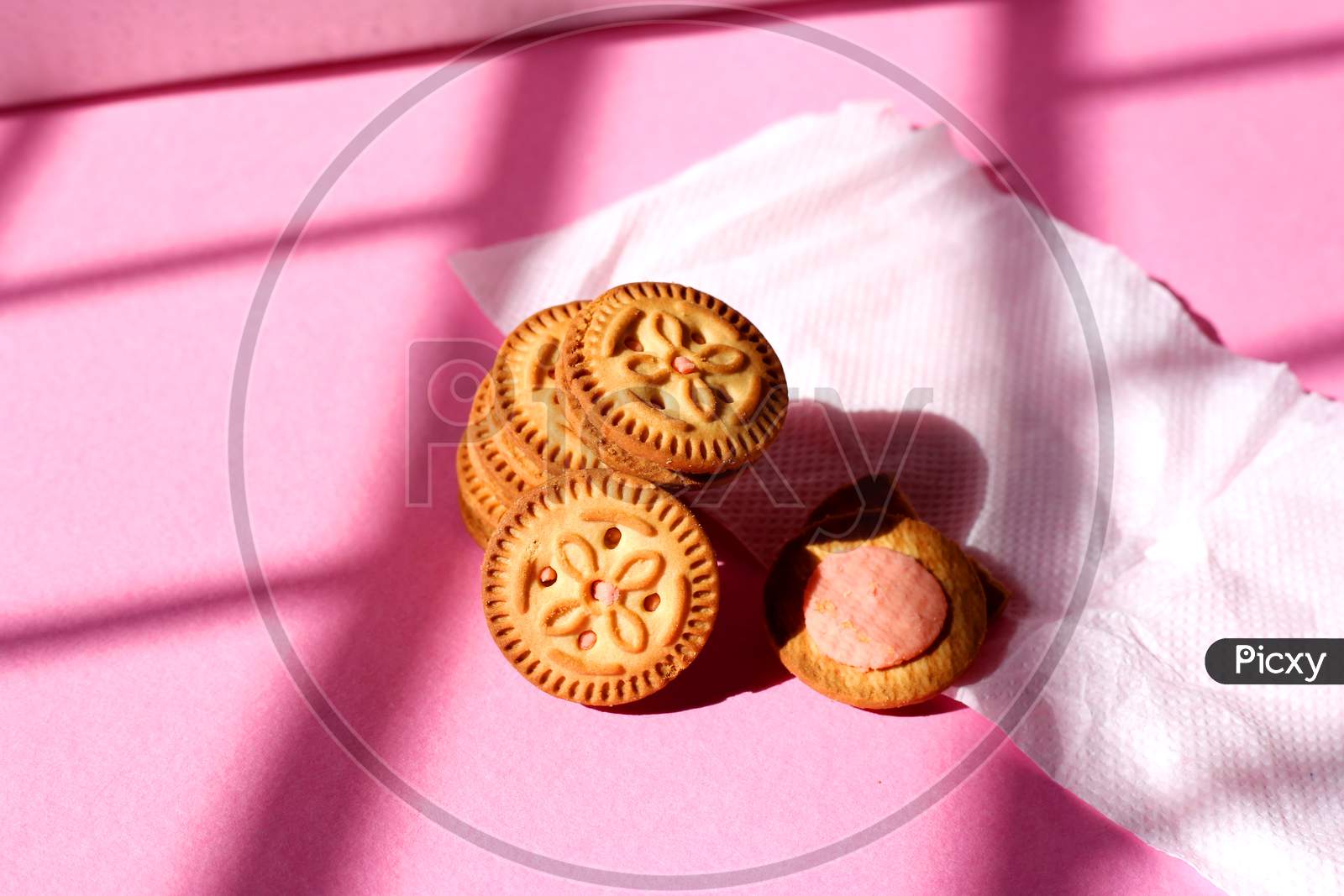 Stacked Biscuits On Pink Isolated Background