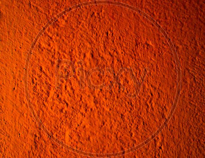 Photography Image of Beautiful Abstract Bright Orange Rough Cement Wall Background In Very Warm Mood With Fine Texture. Pantone of The Year Color Concept Background Banner With Space for Text.