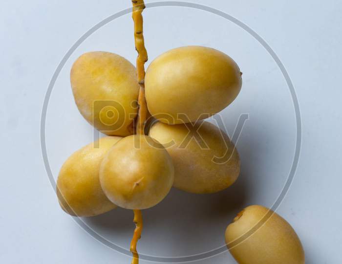 Yellow Fresh Dates Fruit On White Background