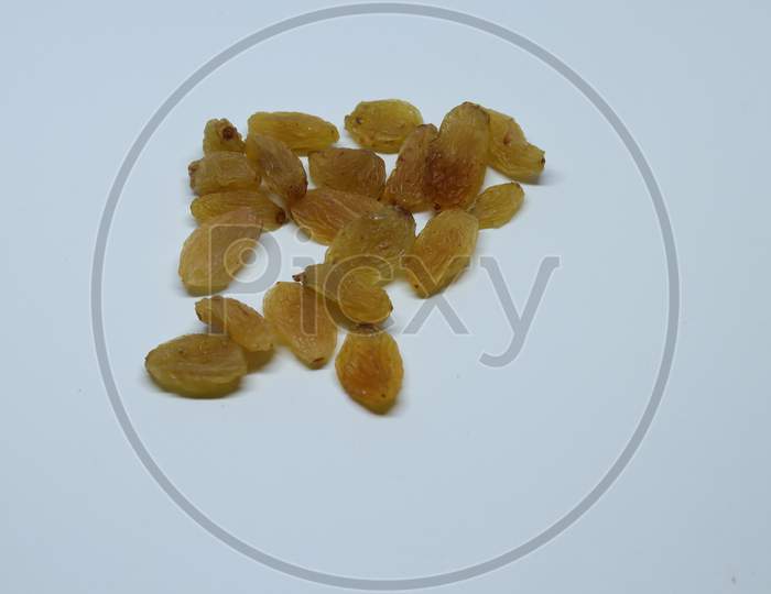 Yellow sultanas raisins isolated on white background