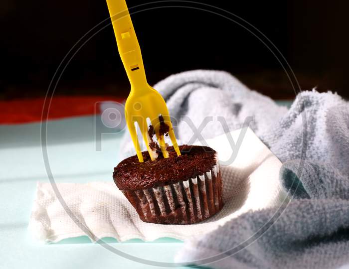 Homemade Chocolate Cupcake On Isolated Background