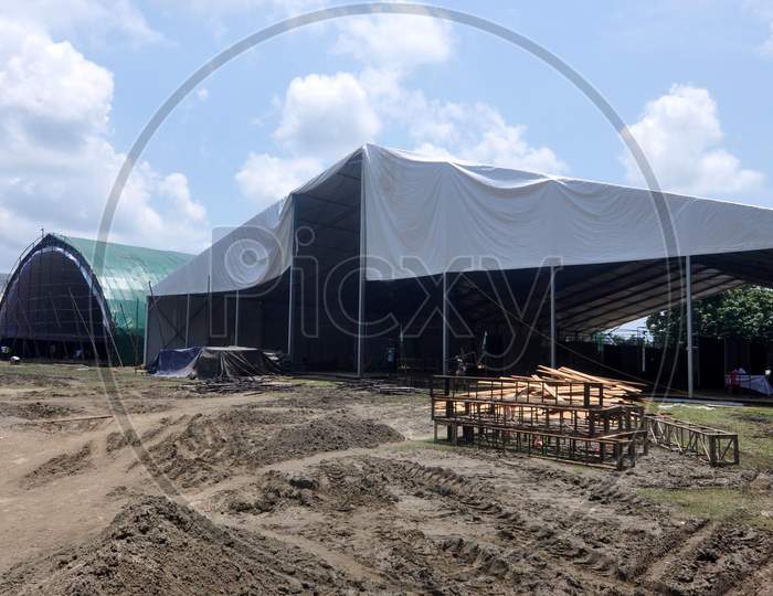 Workers set up a temporary COVID-19 care center at Palasbari in Kamrup District  of Assam, August 1, 2020.