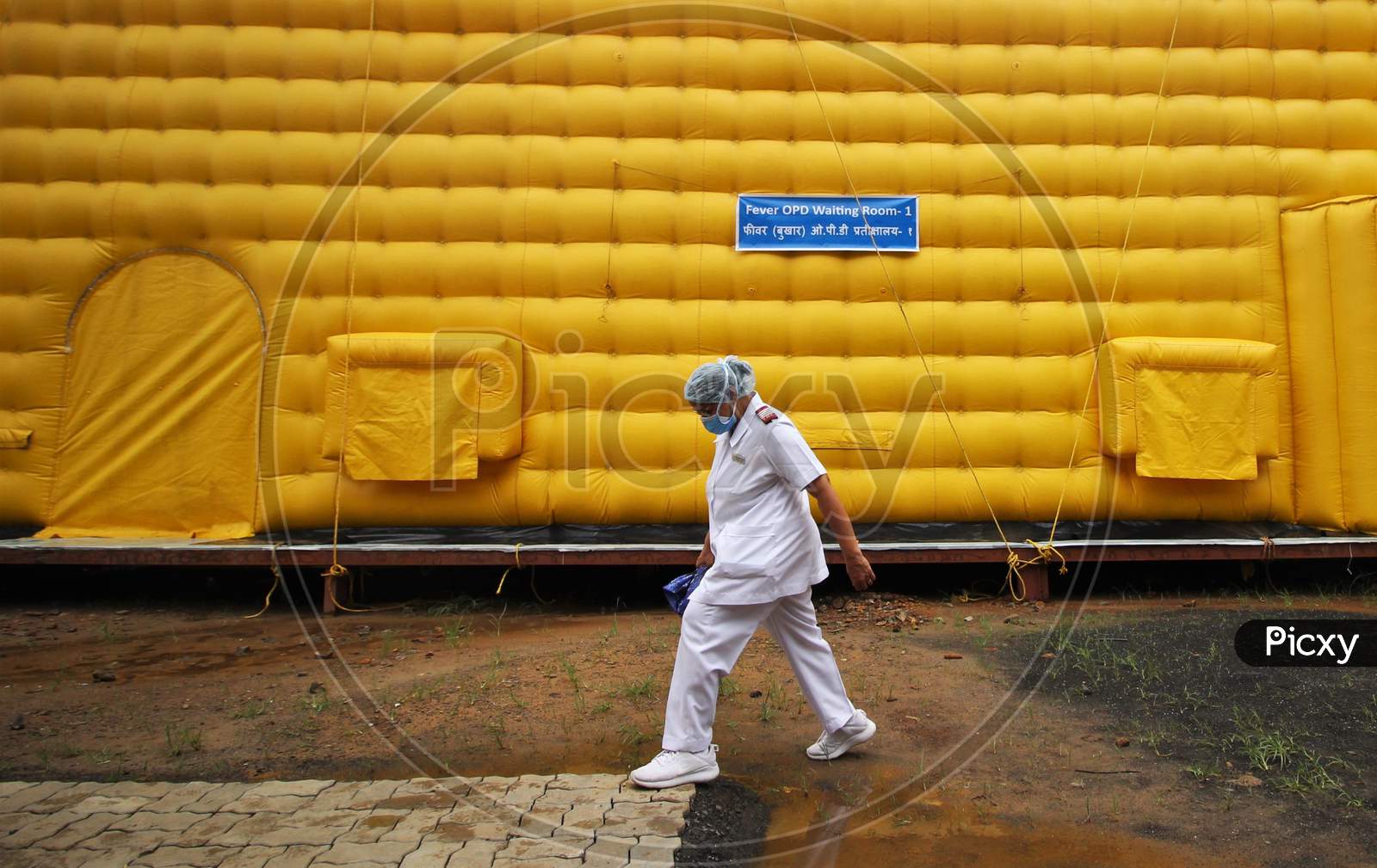 Nurses walk past the newly inaugurated temporary facility created to facilitate cancer patients diagnosed with coronavirus disease (COVID-19) in Mumbai, India on July 30, 2020.
