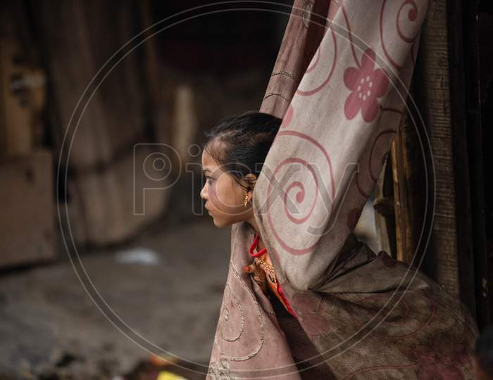 A Rohingya refugee girl wear new clothes and make up during Eid Al-Adha (Feast of Sacrifice) festival at a camp on the outskirts of New Delhi, India on August 1, 2020.