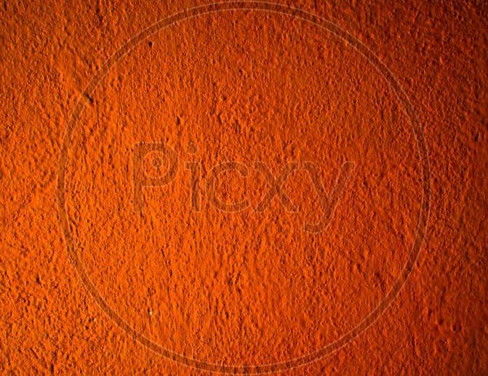 Photography Image of Beautiful Abstract Bright Orange Rough Cement Wall Background In Very Warm Mood With Fine Texture. Pantone of The Year Color Concept Background Banner With Space for Text.
