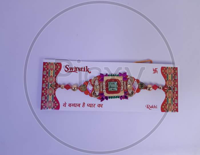Indian festival: Raksha Bandhan white background. A traditional Indian wrist band which is a symbol of love between Brothers and Sisters.