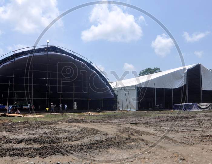 Workers set up a temporary COVID-19 care center at Palasbari in Kamrup District  of Assam, August 1, 2020.