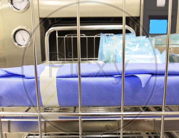 Surgical Instrument Set On Sterilization Machine Trolley