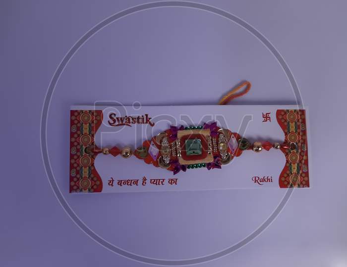 Indian festival: Raksha Bandhan white background. A traditional Indian wrist band which is a symbol of love between Brothers and Sisters.