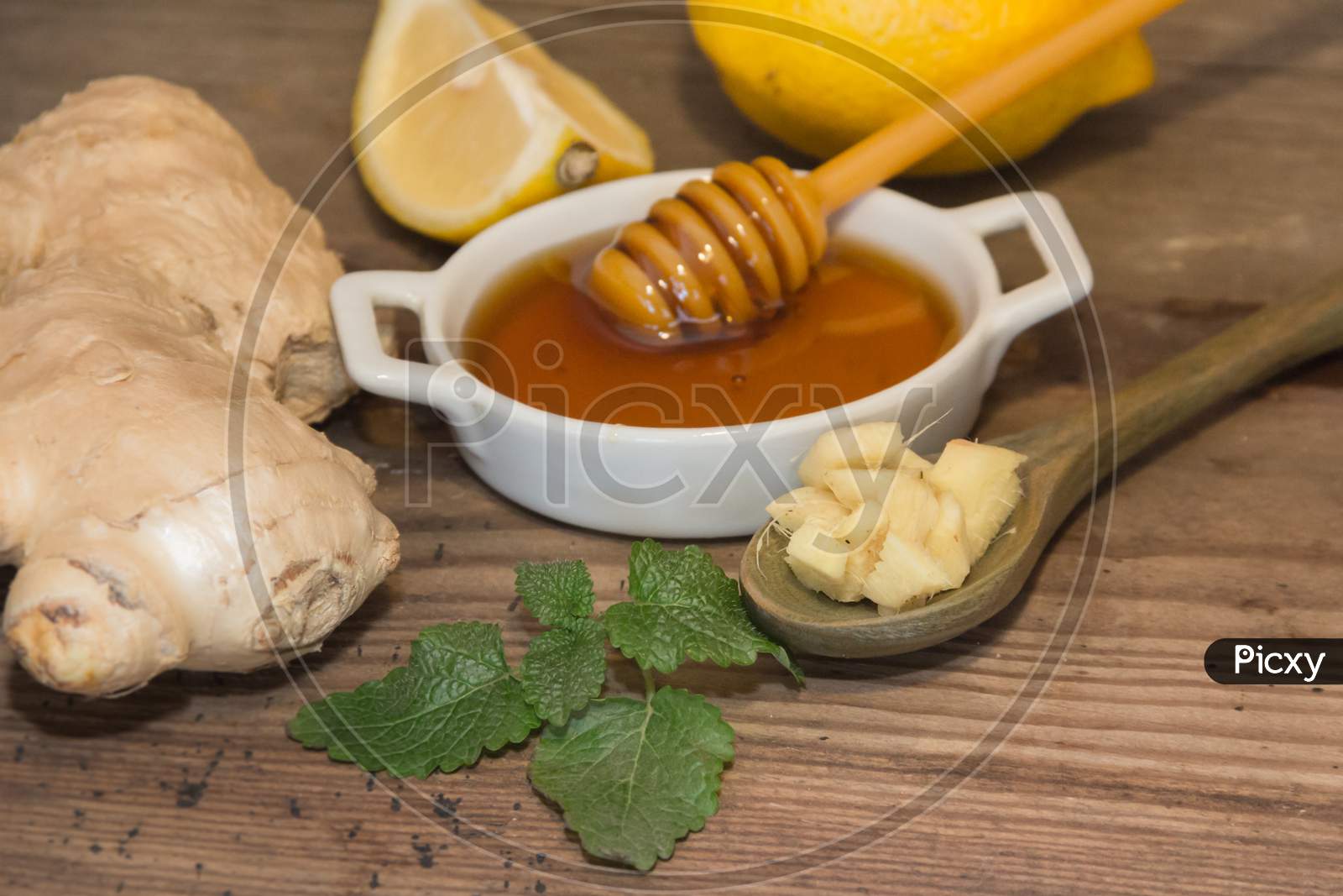 Composition Of Ginger Lemon Honey And Fresh Mint