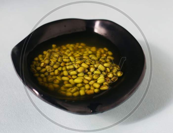 Green Bean Seeds Soaked In A Black Bowl